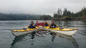 students in kayaks in the Alaskan wilderness