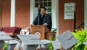 Neil deGrasse Tyson delivering the H-SC commencement address at a podium